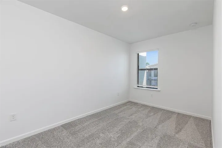 Spare room with carpet floors and recessed lighting