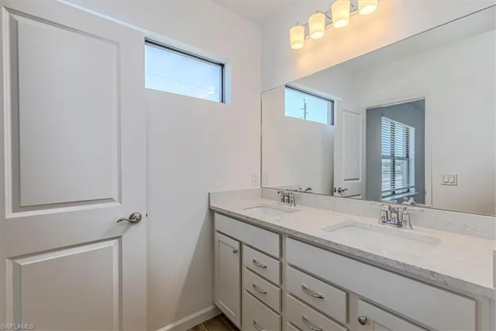 Full bathroom featuring double vanity