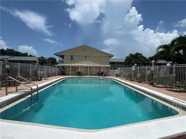 Community pool with a patio area