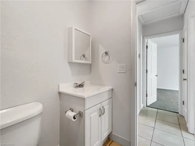 Bathroom with vanity and tile patterned floors