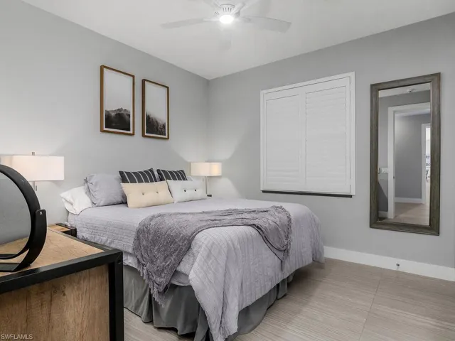 Bedroom with baseboards and a ceiling fan