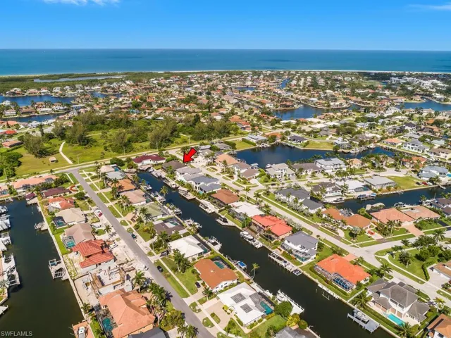 View of property location featuring a nearby body of water and nearby suburban area