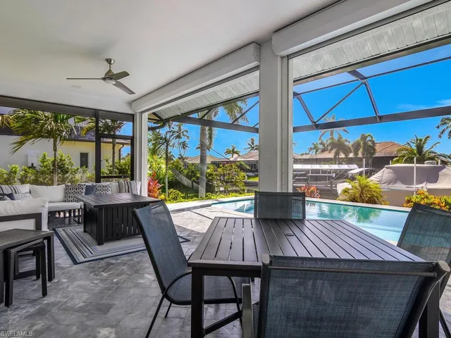 View of patio featuring an outdoor living space, a ceiling fan, an outdoor pool, outdoor dining area, and a lanai