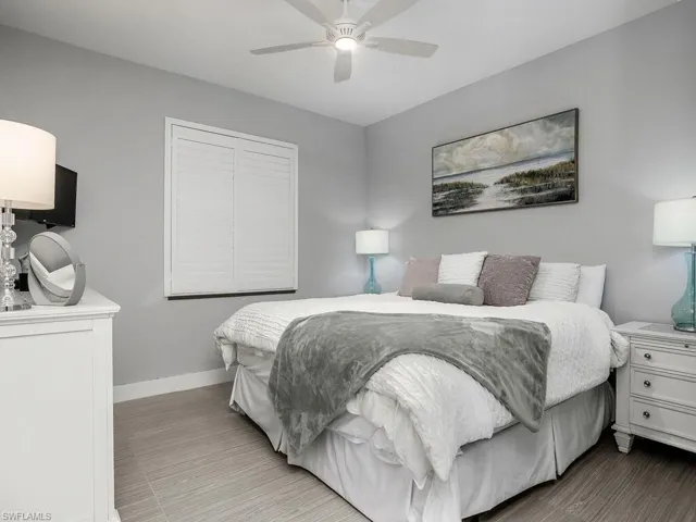 Bedroom with wood finished floors and ceiling fan