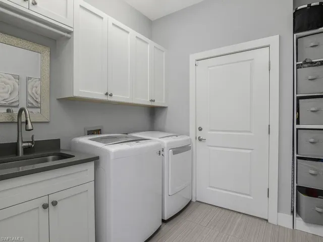 Laundry room with cabinet space and washer and dryer
