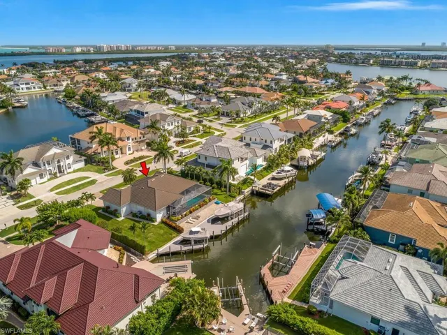 Aerial perspective of suburban area with a large body of water