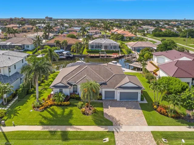 Aerial perspective of suburban area with a large body of water