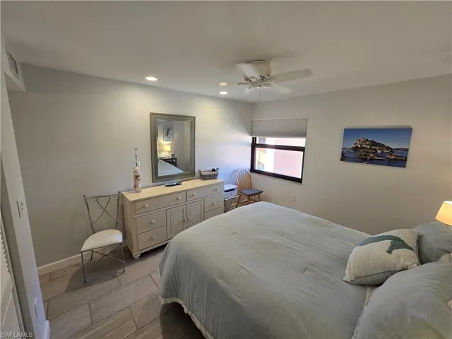Primary Bedroom with a Closet, Ceiling Fan, and Newer Porcelain Tile Flooring!