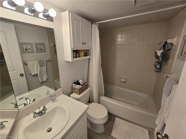 Second Full Bathroom Featuring Shower/Tub Combo with Curtain, Wall Cabinet, Exhaust Fan and Vanity!