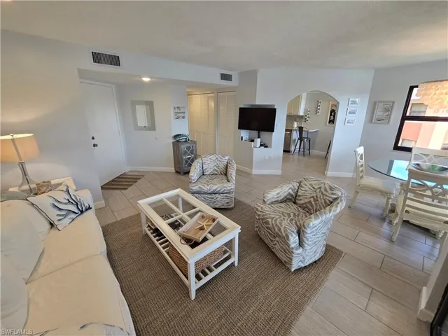Open Floor Plan with Living Room and Dining Room with Arched Opening to Kitchen!