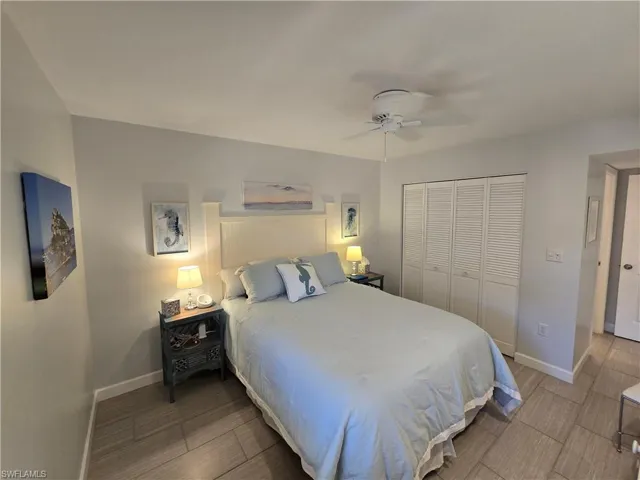 Primary Bedroom with a Closet, Ceiling Fan, and Newer Porcelain Tile Flooring!