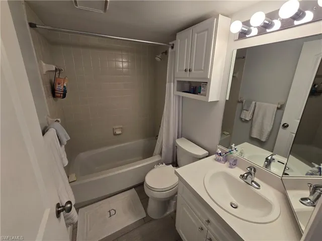 Private Primary Bathroom with Shower/Bathtub Combination with Curtain, Light Bar and Vanity!