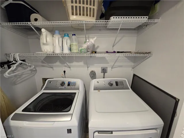 Convenient Laundry Closet off Hallway with Handy Shelving!