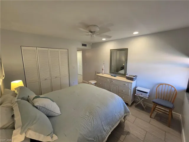 Primary Bedroom with a Closet, Ceiling Fan, and Newer Porcelain Tile Flooring!