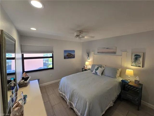 Primary Bedroom with a Closet, Ceiling Fan, and Newer Porcelain Tile Flooring!