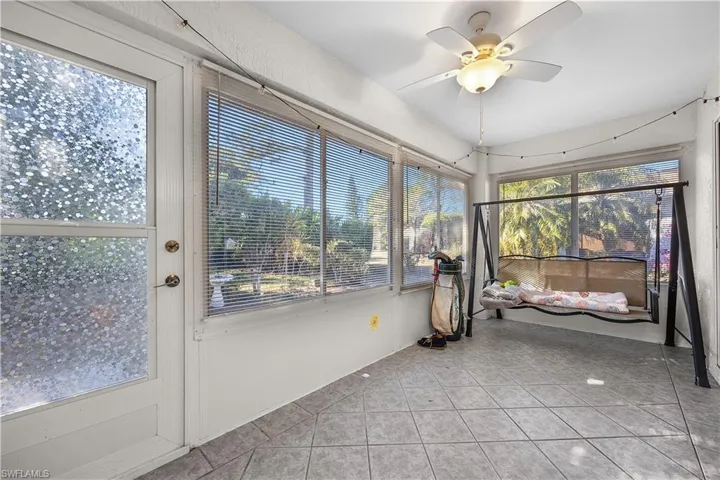 Bedroom featuring carpet floors, a ceiling fan, and vaulted ceiling