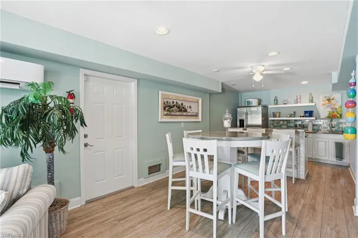 Dining space featuring ceiling fan, light wood-type flooring, and recessed lighting