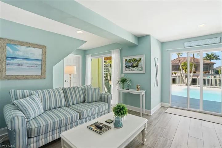 Living area featuring wood finished floors and recessed lighting