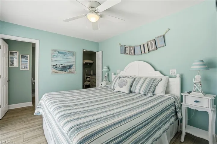 Bedroom featuring wood finished floors and ceiling fan