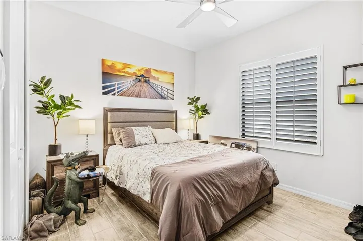 Bedroom featuring wood finished floors and ceiling fan