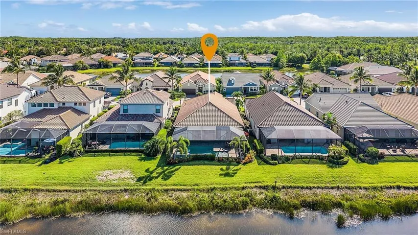 Aerial view of residential area with a nearby body of water