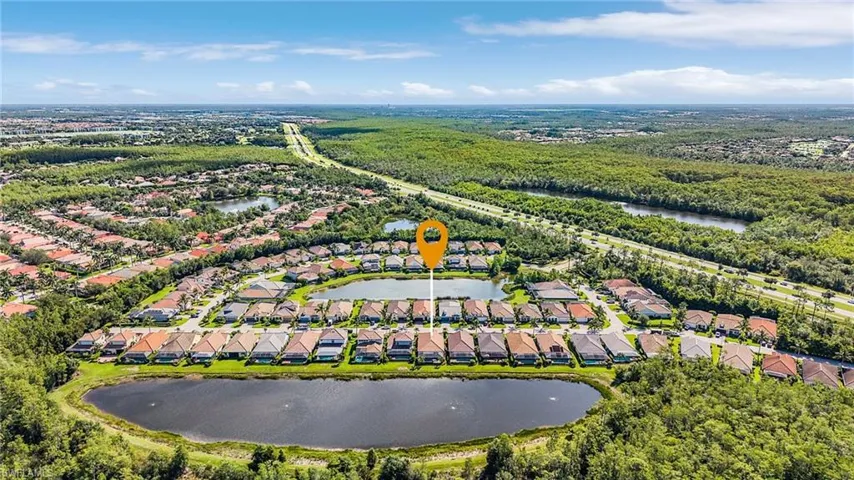 Aerial view of residential area with a large body of water