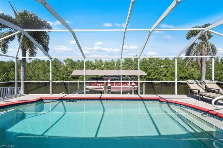 OVERLOOKING MANGROVES AND CANAL FILLED WITH SEA LIFE, DOLPHINS & MANATEE VISITS.