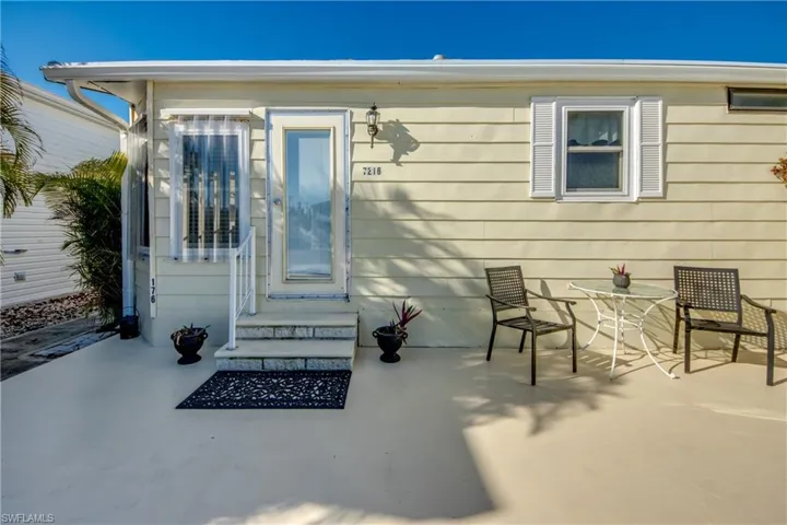 Doorway to property featuring a patio area