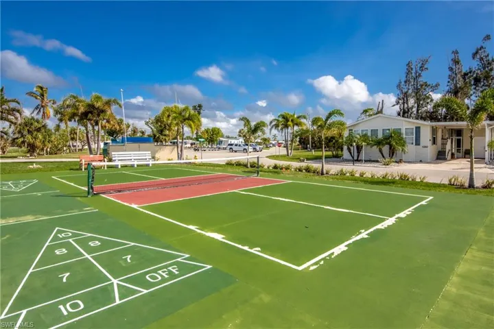 View of property's community with tennis court