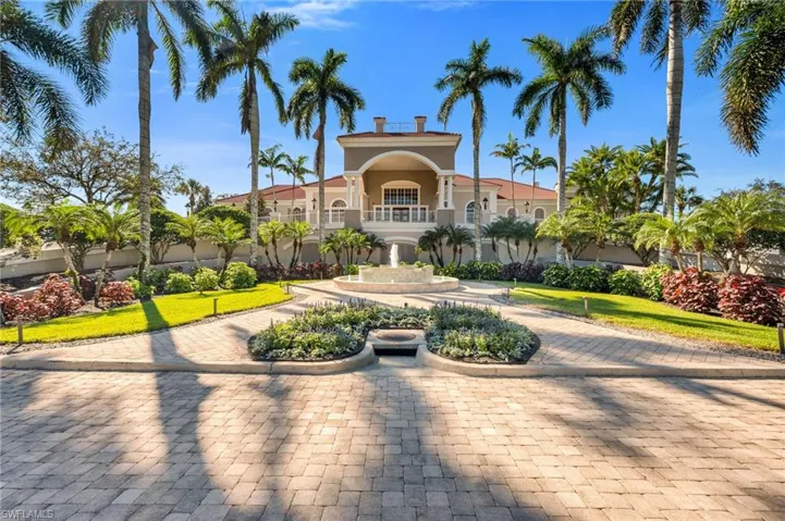 View of front of home with stucco siding and a patio