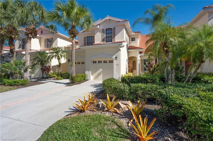 Mediterranean / spanish home featuring concrete driveway, a tiled roof, stucco siding, and an attached garage