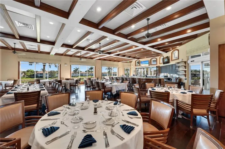 Dining area featuring a ceiling fan, beam ceiling, coffered ceiling, plenty of natural light, and recessed lighting