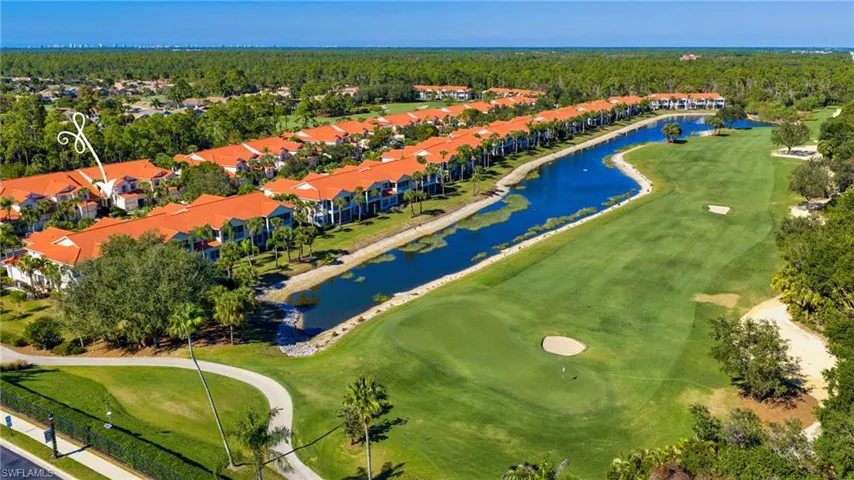 Aerial view of a local golf course and a nearby body of water