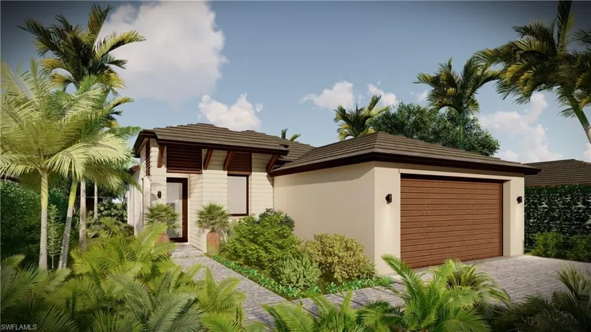 View of front of home with a garage and an outdoor structure