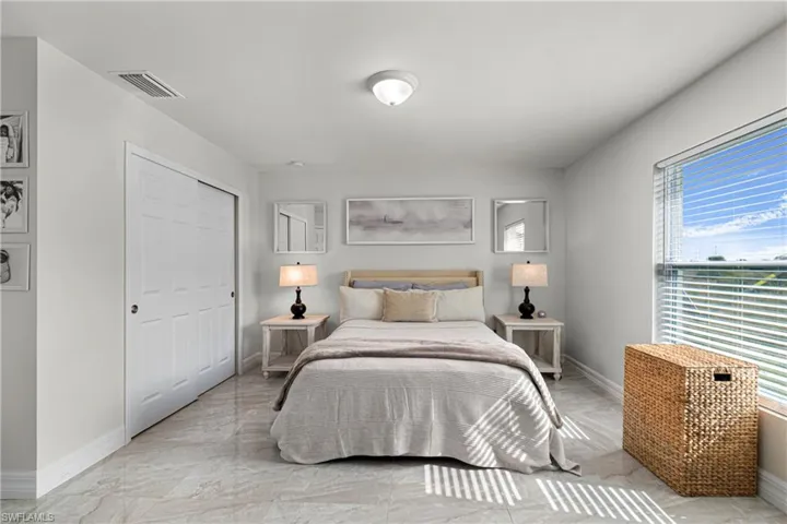 Bedroom with baseboards and a closet
