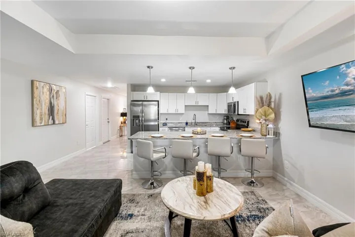 Living room with baseboards and recessed lighting