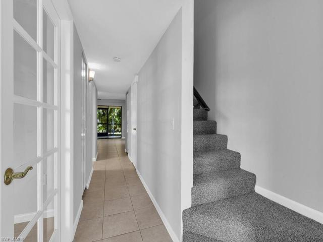 Foyer entry with new stair carpet