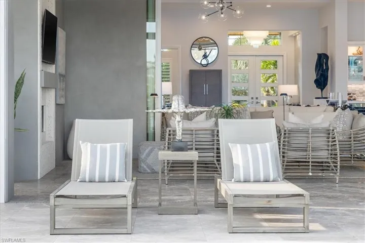 View of patio with french doors and ceiling fan