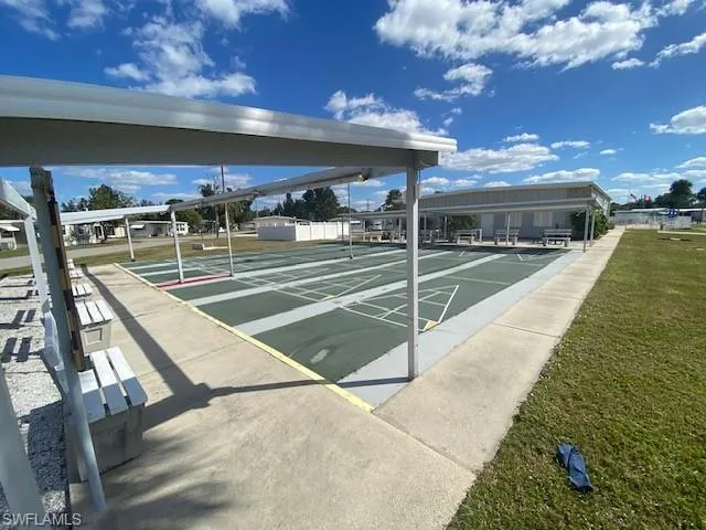 View of home's community with shuffleboard