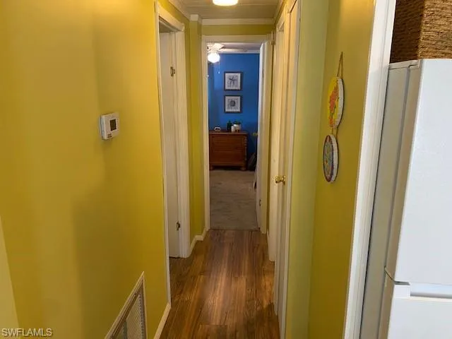 Hall with dark wood finished floors