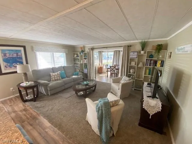 Living area featuring healthy amount of natural light and wood finished floors