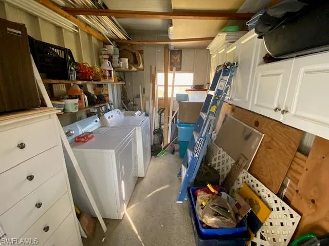 Basement featuring washer and clothes dryer
