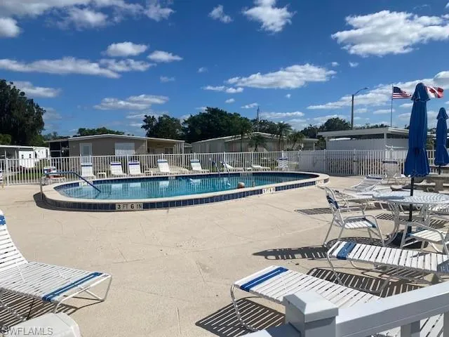 Community pool featuring a patio area