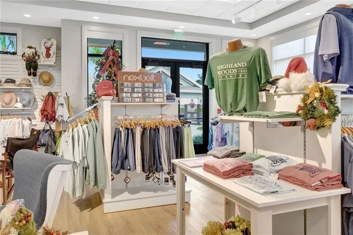 Retail space featuring wood-finish flooring, recessed lighting, and large storefront windows
