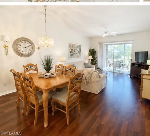 Open-concept living area featuring rich wood-finish flooring throughout