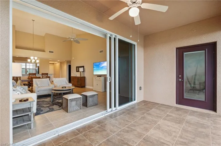 View of patio featuring ceiling fan