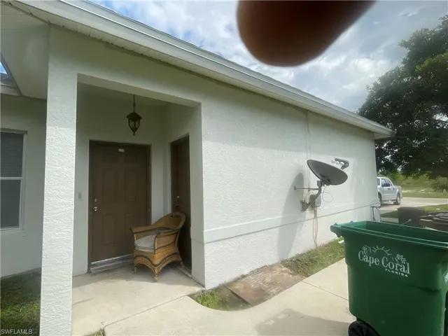 View of side of home with stucco siding