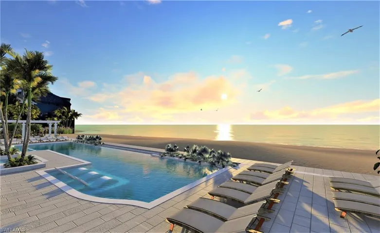 Pool at dusk with a water view and a patio