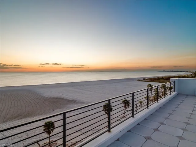 Balcony at dusk with a water view