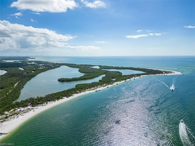 Bird's eye view featuring a water view and a beach view